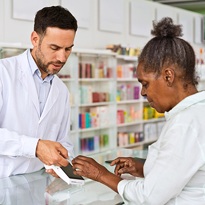 A customer checking out with a Pharmacist 