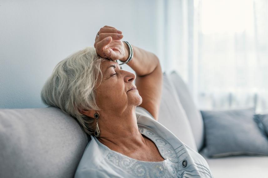 A senior rests on the couch